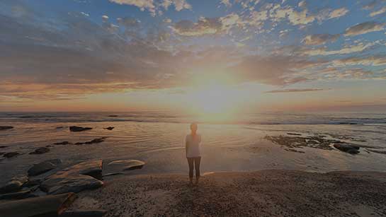 Recovering woman looking at sunset