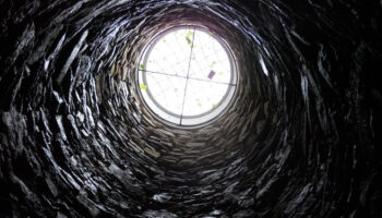 A view from the bottom of a well, signifying hitting rock bottom