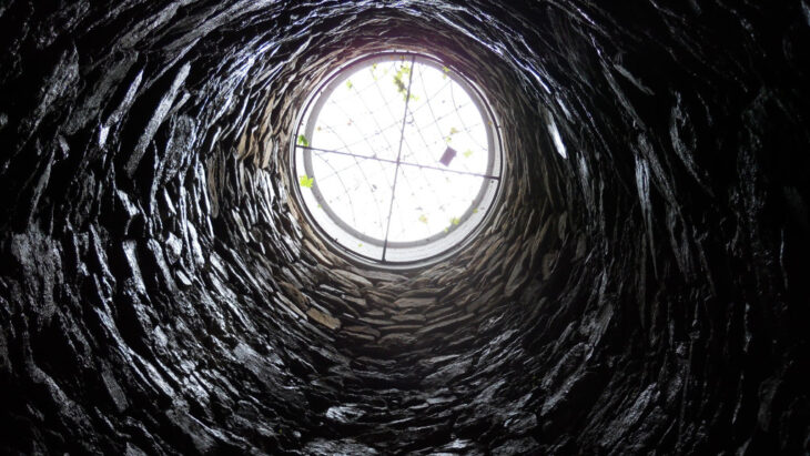 A view from the bottom of a well, signifying hitting rock bottom