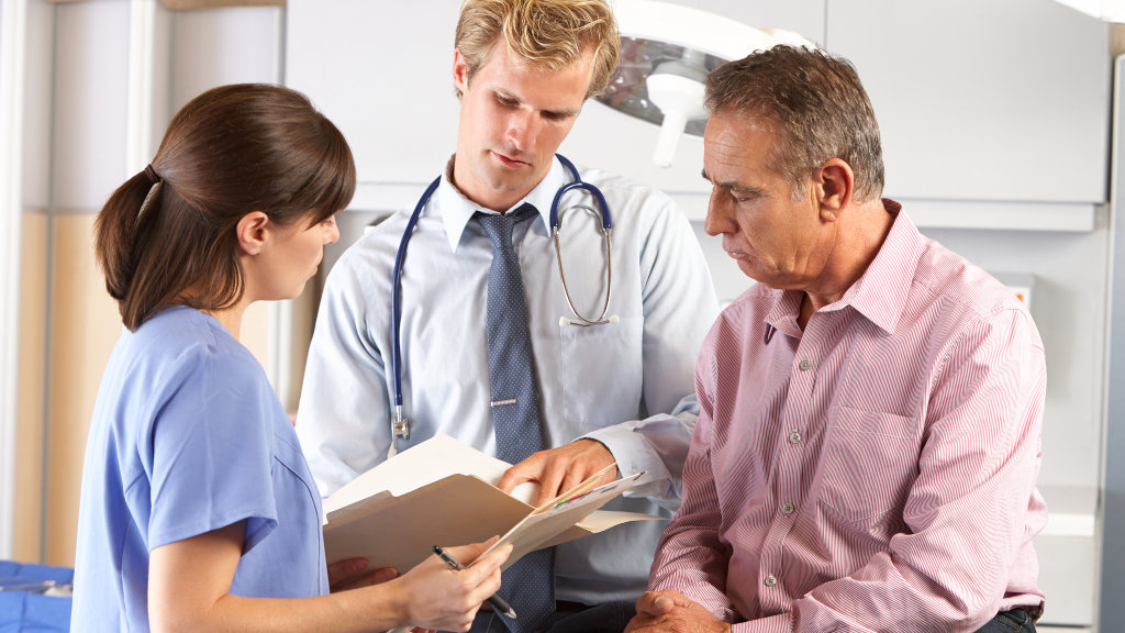 Doctors speaking with a patient during an appointment