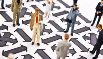 People networking on a board with arrows. Learn more about these 3 ways that craft beer culture encourages alcohol abuse here.