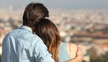 Two people who are dating embrace each other while on a date