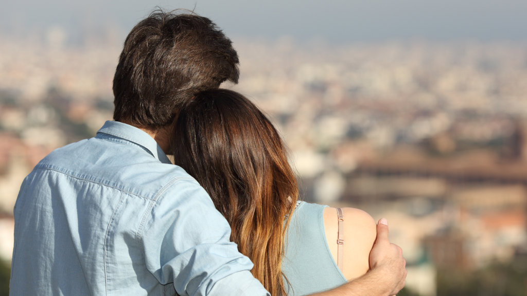 Two people who are dating embrace each other while on a date