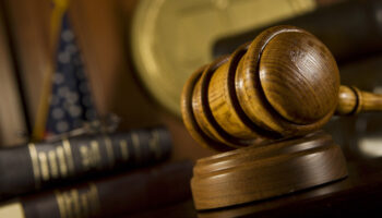 A gavel at a judge's desk in court