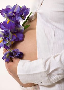 Pregnant mother holding flowers