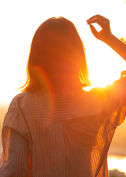 Teen girl enjoying the sunset after putting an end to abusing drugs and alcohol