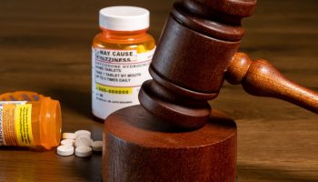 gavel and pill bottles