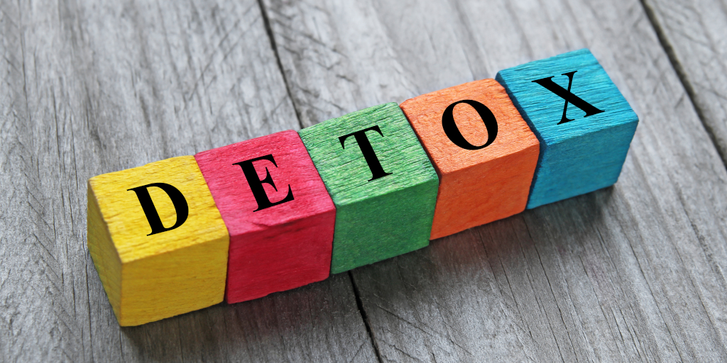 Wooden blocks spelling out 'DETOX'