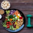 A fresh salad and supplements with weights- all part of a natural detox