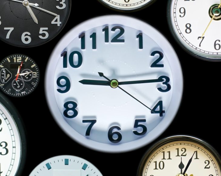 A stock photo with a half dozen clocks pointed towards various times