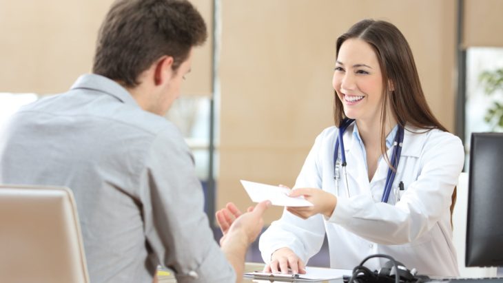A doctor speaks with a patient about an aftercare plan to maintain sobriety