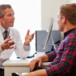 A doctor discusses drug detox methods with a patient during an appointment