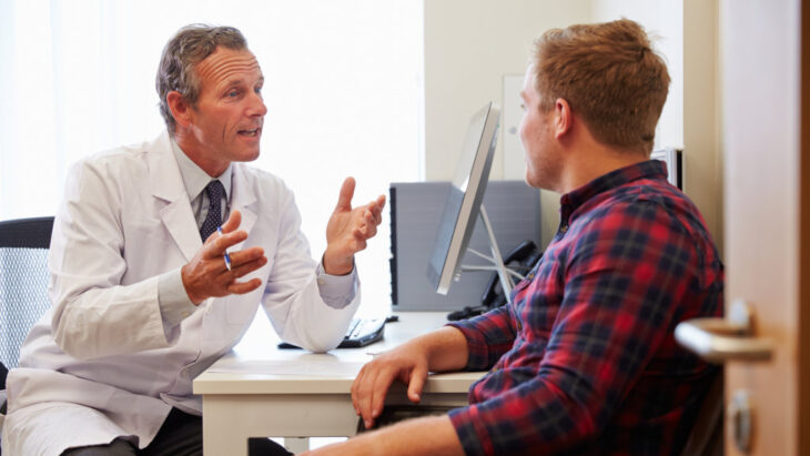A doctor discusses drug detox methods with a patient during an appointment