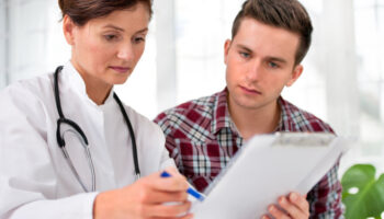 A doctor speaking with a patient at a detox treatment center