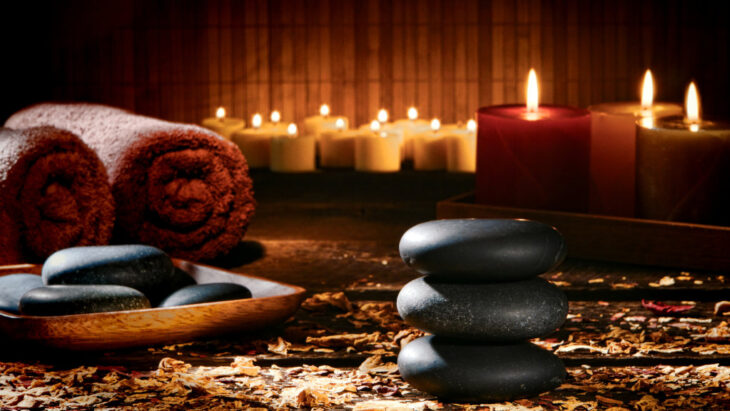 hot stones, candles, and a towel- commonly seen as part of holistic care and detox