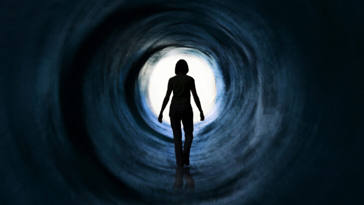 A person sees light at the end of a dark tunnel. Learn more about molly overdose here, at detox.com