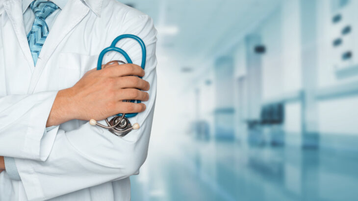A doctor holding a stethoscope inside a hospital. find top centers for marijuana rehab near you