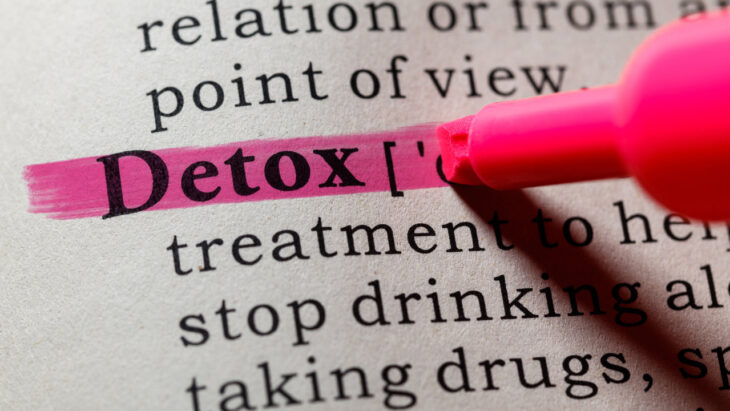 A highlighter marking the word "Detox" in a dictionary. learn more about what detox is here.