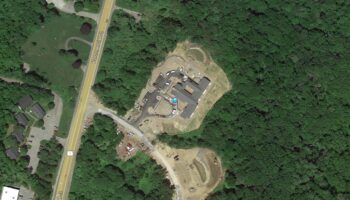 Exterior overhead map view showing PARC Program facility layout, parking areas, building structures, and surrounding forest