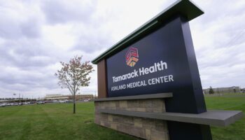 Exterior signage displaying Tamarack Health Ashland Medical Center branding with parking lot and facility building in background