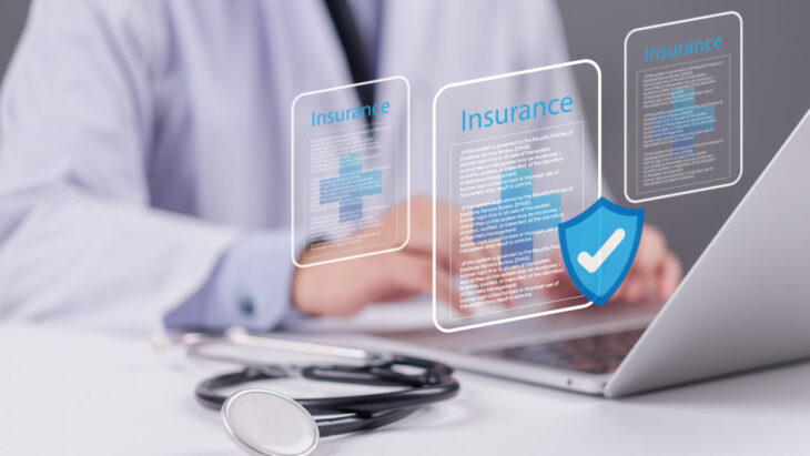 A doctor taps a graphic representing medical insurance. Does Humana cover drug and alcohol detox and rehab? Learn more here.